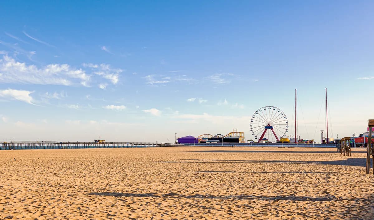 Ferris wheel and boardwalk attractions along Ocean City.